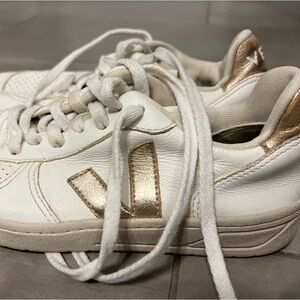 Women’s Veja shoes, white w/ gold accents. Size 6. Used.